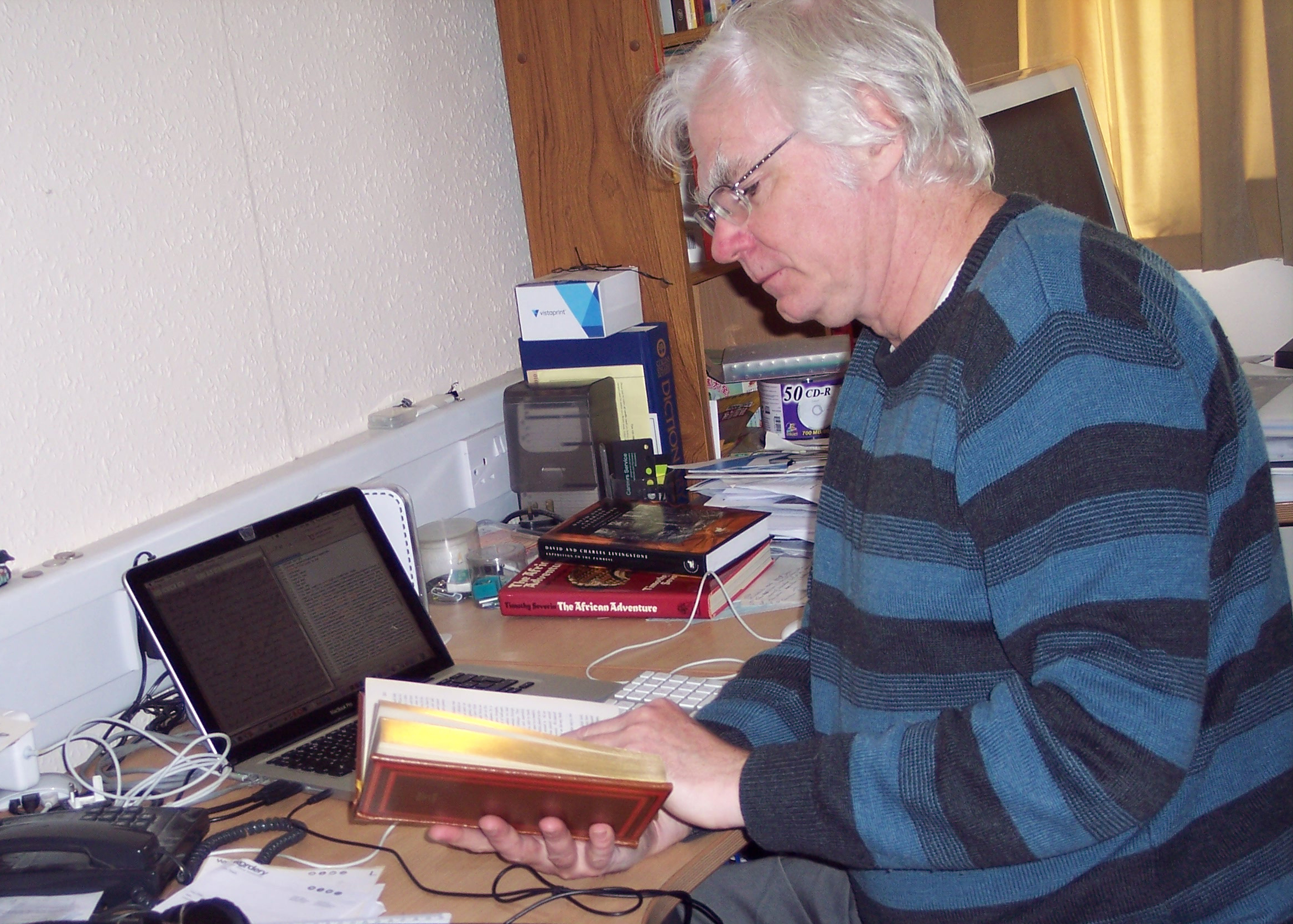 Stephen Hall in his office, Glasgow, 2019. Copyright Stephen Hall. Creative Commons Attribution-NonCommercial 3.0 Unported (https://creativecommons.org/licenses/by-nc/3.0/).