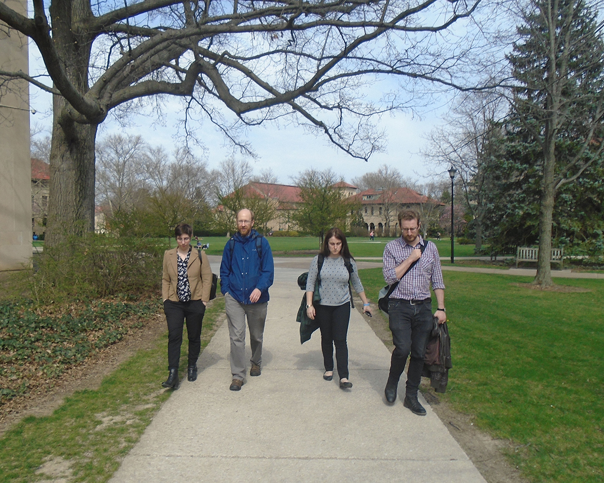 Mary Borgo Ton, Adrian S. Wisnicki, Heather F. Ball, and Justin D. Livingstone walking on the grounds of Oberlin College, 2017. Copyright Kate Simpson. Creative Commons Attribution-NonCommercial 3.0 Unported (https://creativecommons.org/licenses/by-nc/3.0/).
