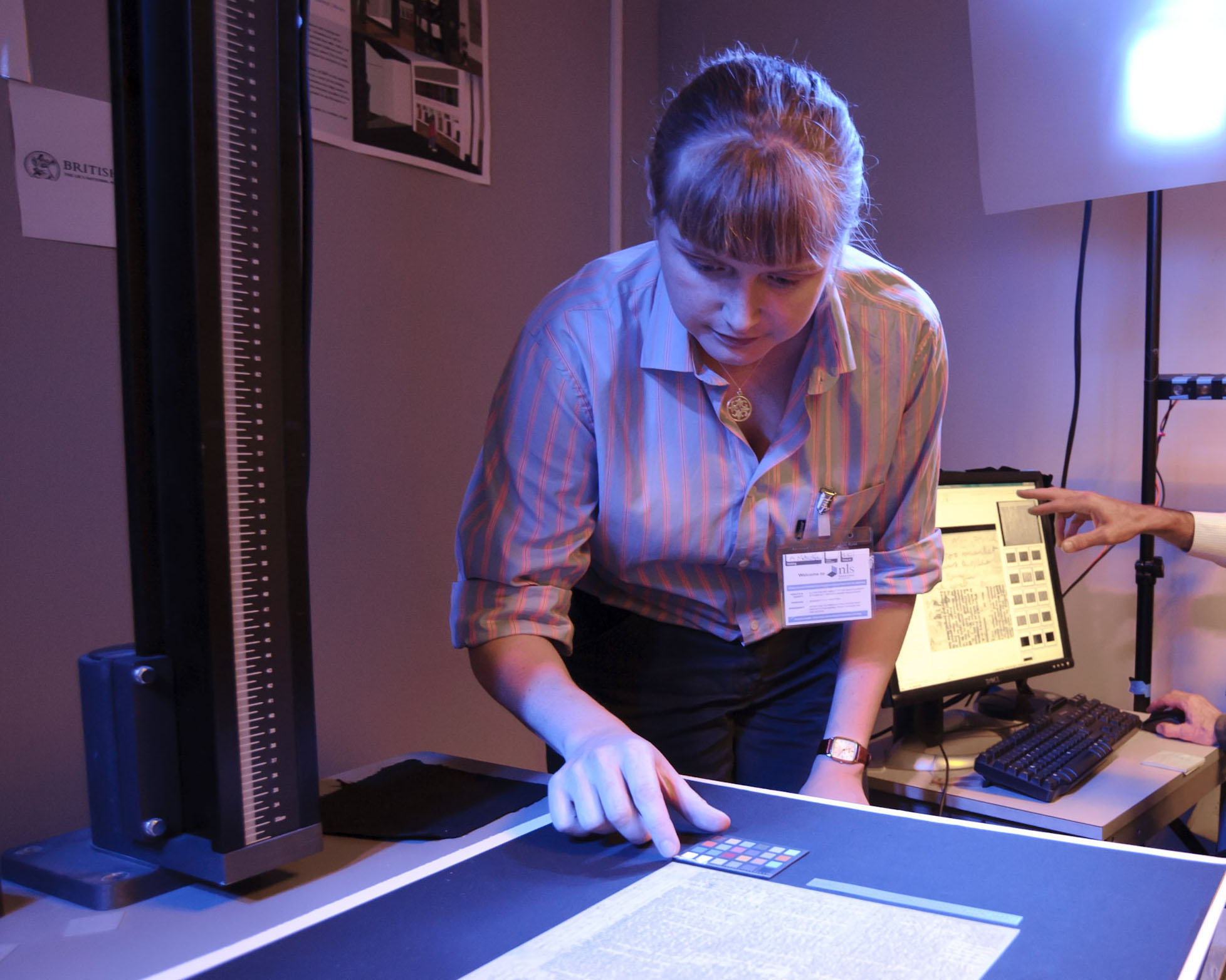 Kate Simpson positions a page of the 1871 Field Diary during the spectral imaging of the diary at the National Library of Scotland, Edinburgh, 2010. Copyright Callum Bennetts - Maverick Photo Agency. Used by permission