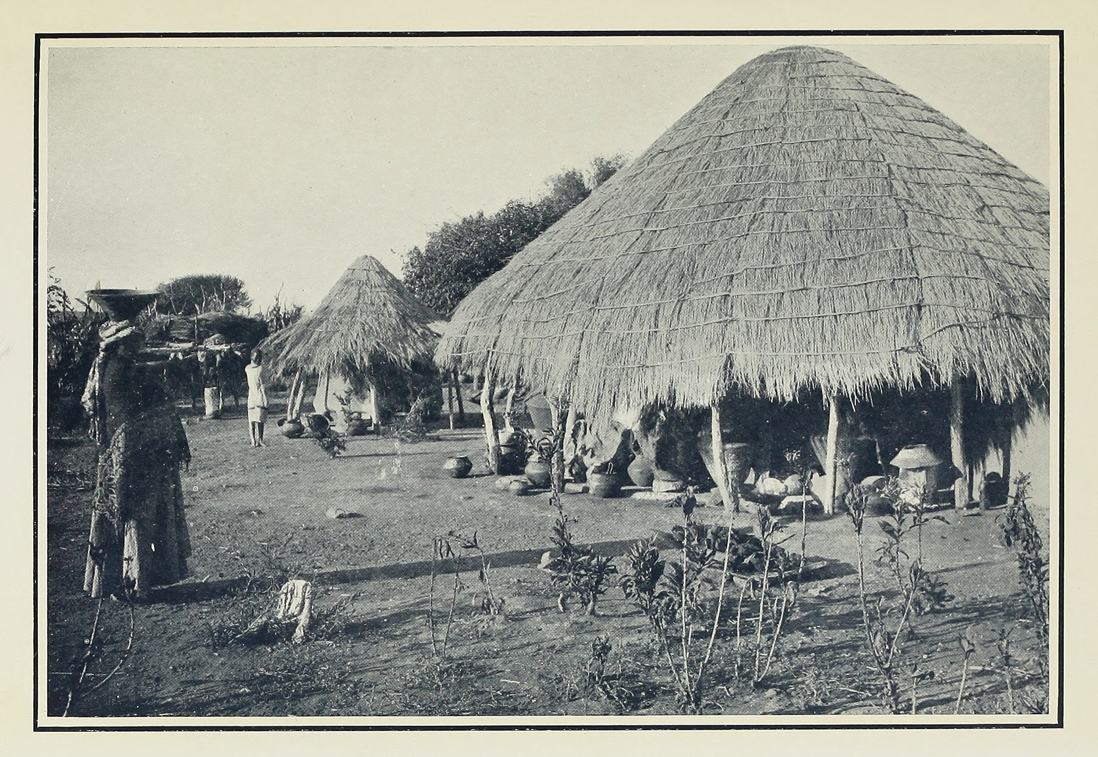 Scene in a Village of the Bechuana. Illustration from J. Tom Brown, Among the Bantu Nomads (London: Seely, Service & Co., 1926), opposite 48. Courtesy of the Internet Archive (https://archive.org/details/amongbantunomads00brow).