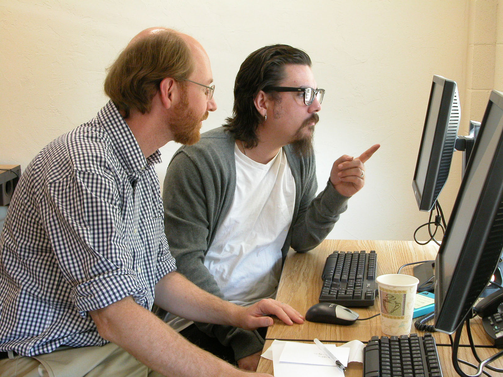 Adrian S. Wisnicki and A.J. Schmitz examine their TEI P5 encoding of Livingstone's Unyanyembe Journal at the Center for Digital Humanities and Culture, Indiana University of Pennsylvania, 2011. Copyright Livingstone Spectral Imaging Project team. Creative Commons Attribution-NonCommercial 3.0 Unported (https://creativecommons.org/licenses/by-nc/3.0/).